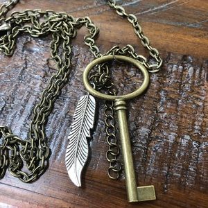 Bronze necklace with key and silver feather